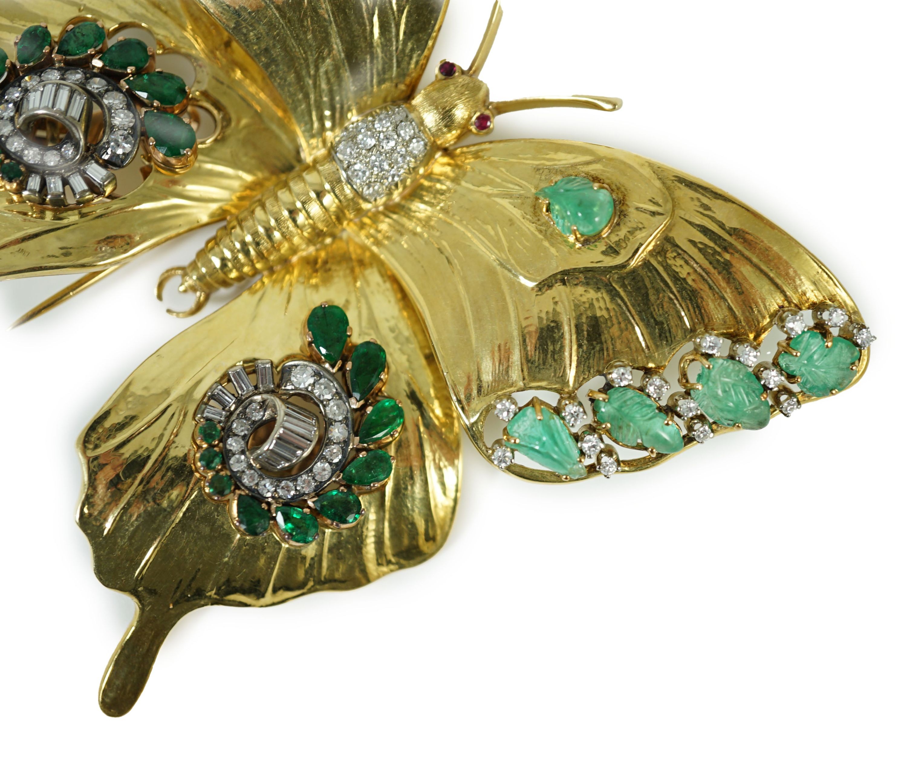 A modern 18ct gold, emerald and diamond set butterfly clip brooch